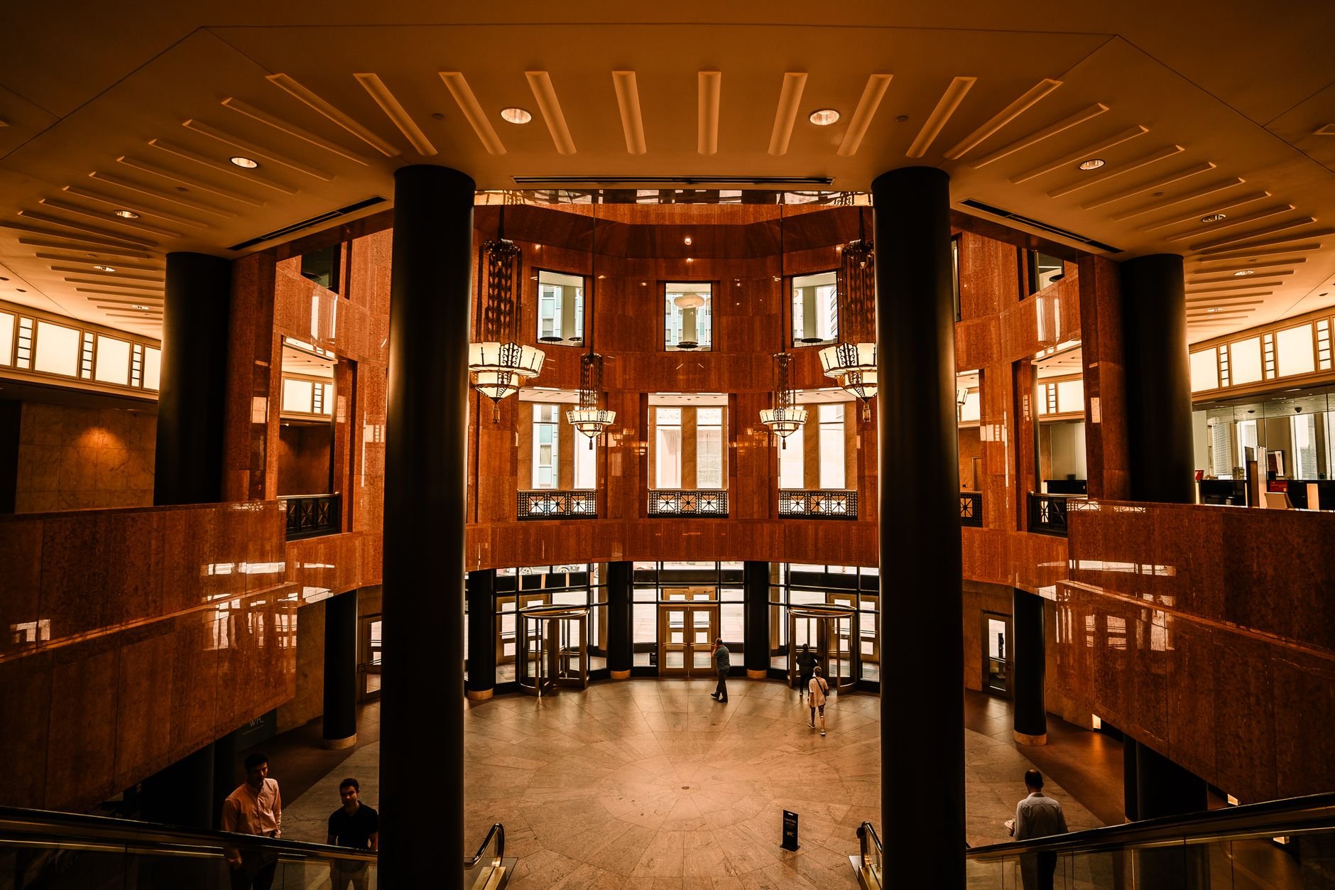 Grand interior view of a Minneapolis office building featuring modern architecture and warm lighting.